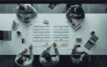 Business owner reviewing capital stack planning with advisors