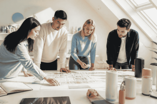 Startup founders preparing growth milestones and investor materials before fundraising