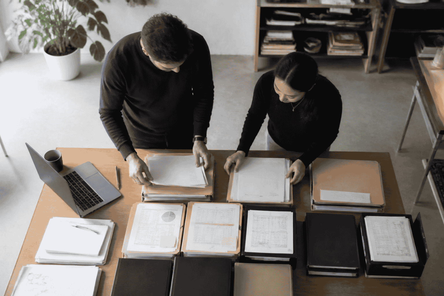Startup founder organizing data room documents before investor due diligence