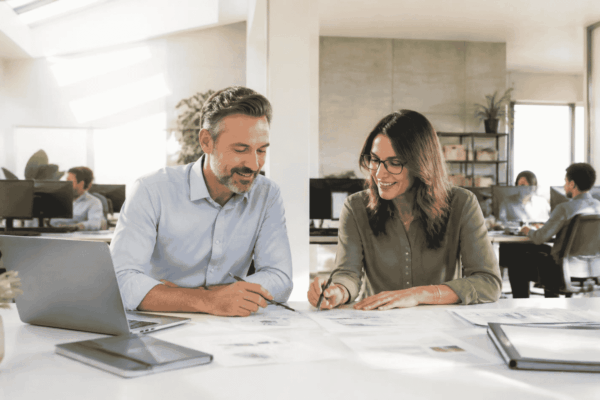 Business owner reviewing technology upgrade financing documents with a funding advisor