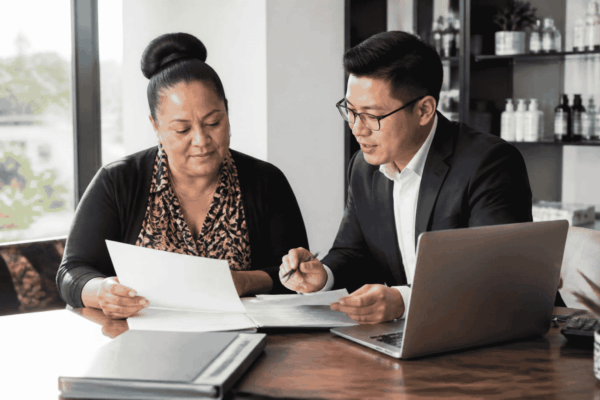 Business owner reviewing line of credit qualification documents and financial statements