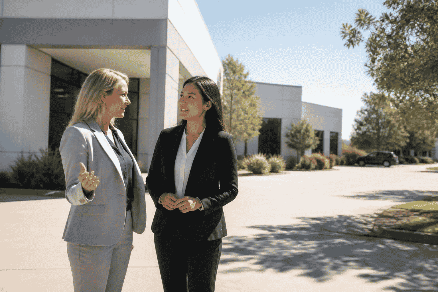 Business owner and broker evaluating whether to sell commercial real estate with a business