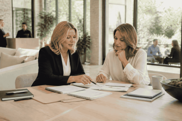 Business owner and advisor deciding whether to sell a company now or build more value first